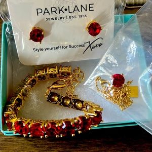 Brand new necklace earring and bracelet set red round stone and gold tone